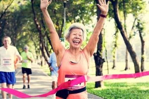 menopausal woman finishing a marathon