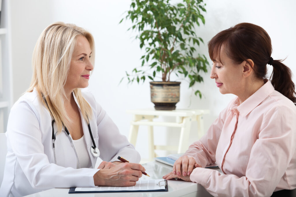 woman talking to her doctor about menopause treatments